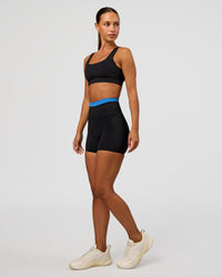 Woman wearing Liberate High-Rise 4" Short Pockets - Black-Palace Blue | Model:Brylee | Size:XS | Thumbnail Index: 3