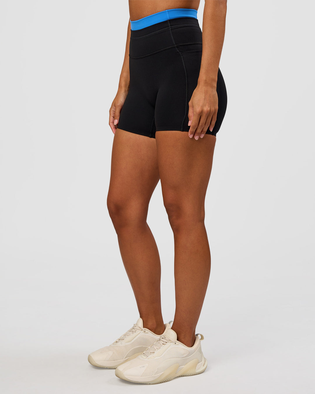 Woman wearing Liberate High-Rise 4" Short Pockets - Black-Palace Blue | Model:Brylee | Size:XS - view 1