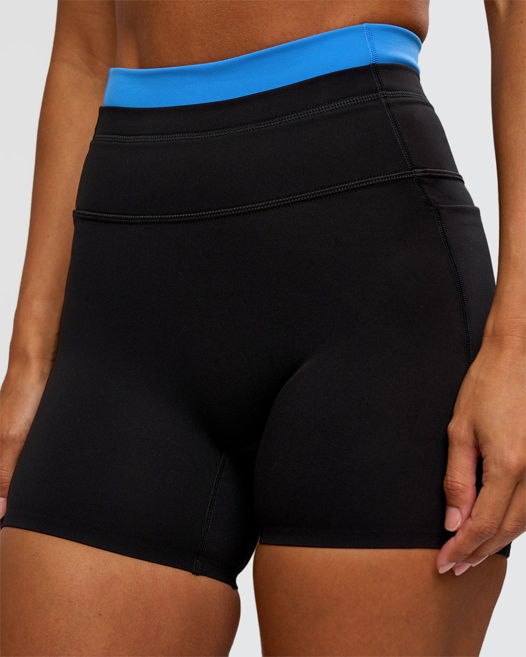 Woman wearing Liberate High-Rise 4" Short Pockets - Black-Palace Blue | Model:Brylee | Size:XS - view 6
