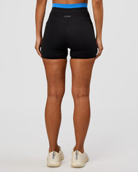 Woman wearing Liberate High-Rise 4" Short Pockets - Black-Palace Blue | Model:Brylee | Size:XS | Thumbnail Index: 6