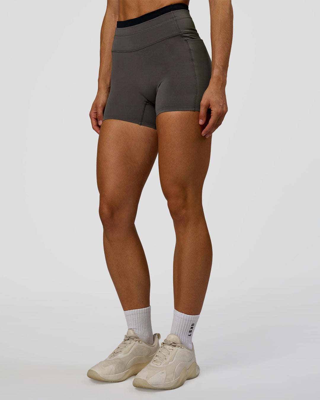 Woman wearing Liberate High-Rise 4" Short Pockets in Duskstone-Black | Model:Maja | Size:XS