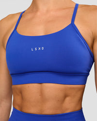Woman wearing Lift Sports Bra - Electric Indigo | Model:Maja | Size:XS