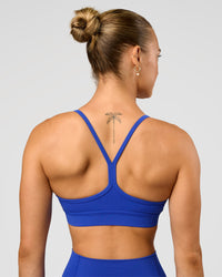 Woman wearing Lift Sports Bra - Electric Indigo | Model:Maja | Size:XS