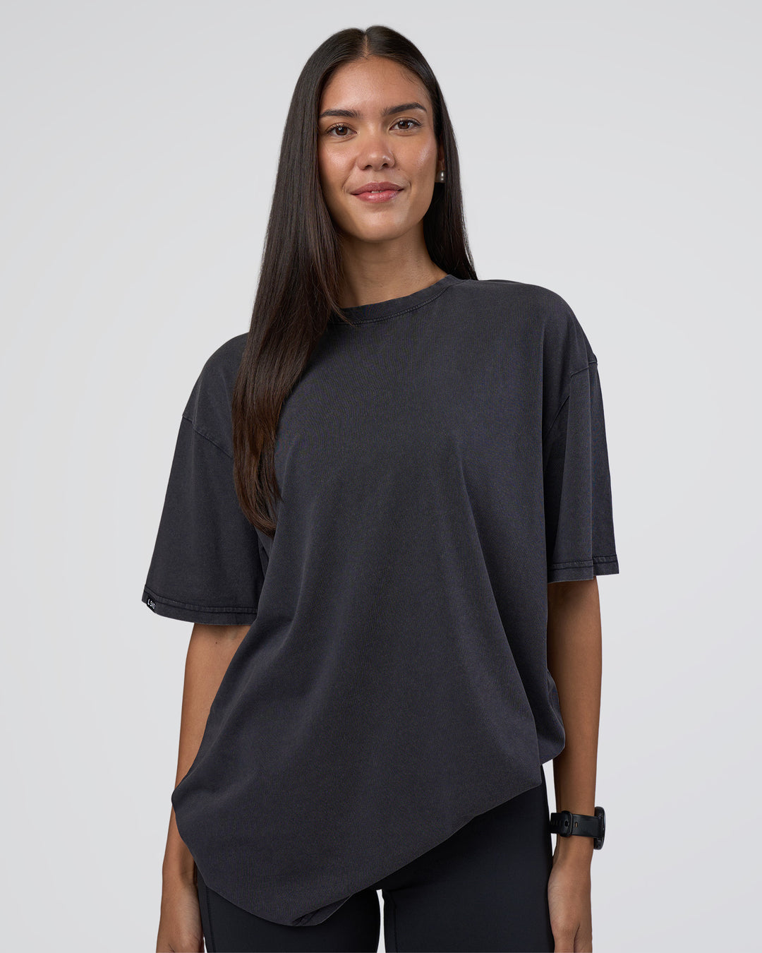Woman wearing Lifting Club FLXCotton Tee Oversize - Black Washed | Model:Rhiley | Size:XS