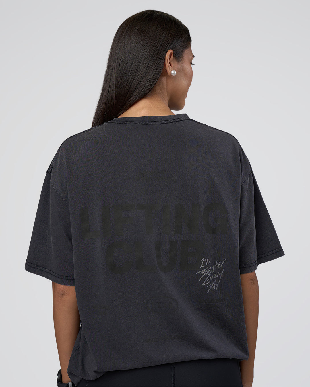 Woman wearing Lifting Club FLXCotton Tee Oversize - Black Washed | Model:Rhiley | Size:XS