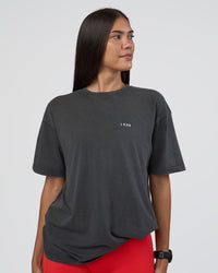 Woman wearing Lifting FLXCotton Oversized Tee - Black Washed-Flame | Model:Rhiley | Size:XS