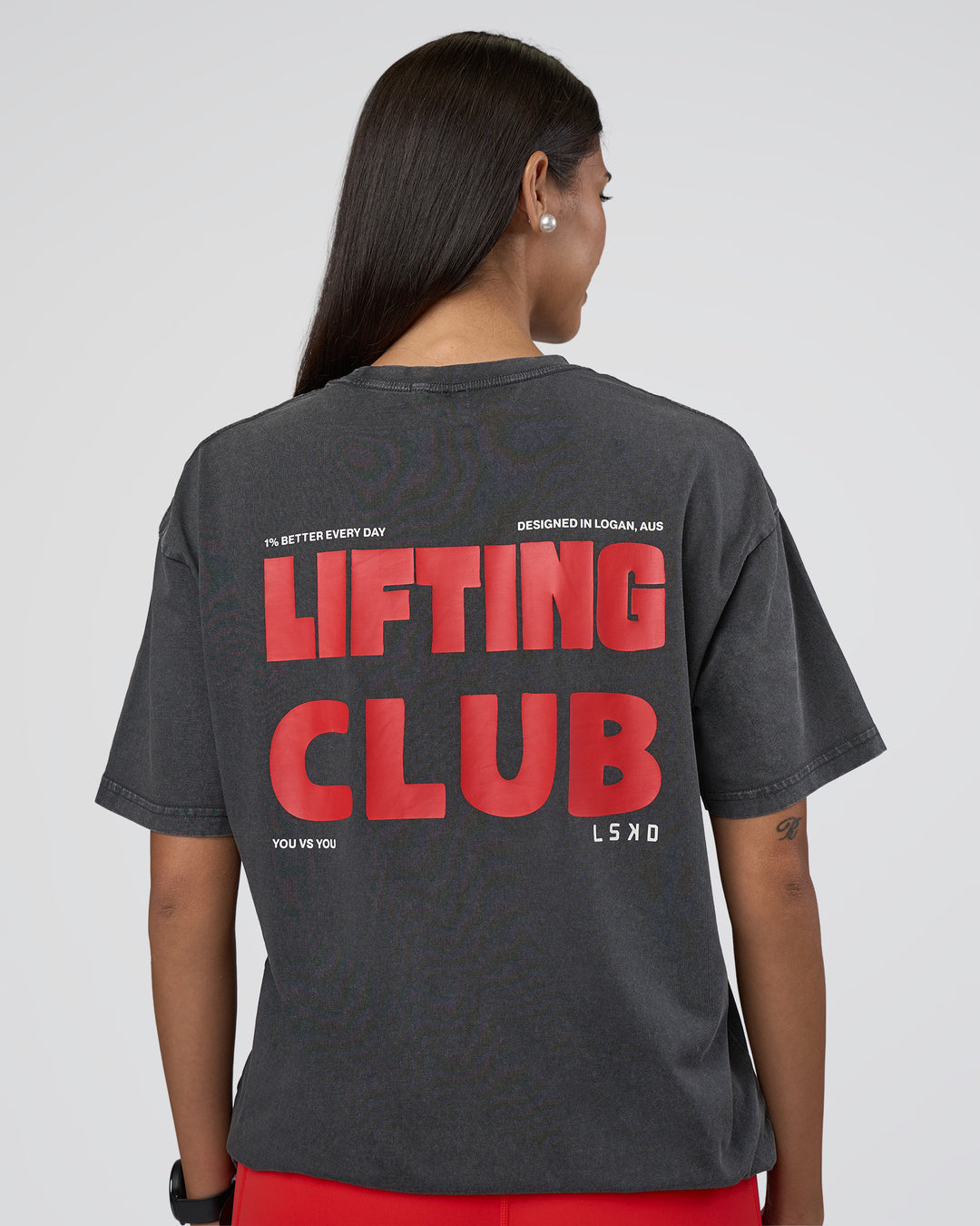 Woman wearing Lifting FLXCotton Oversized Tee - Black Washed-Flame | Model:Rhiley | Size:XS