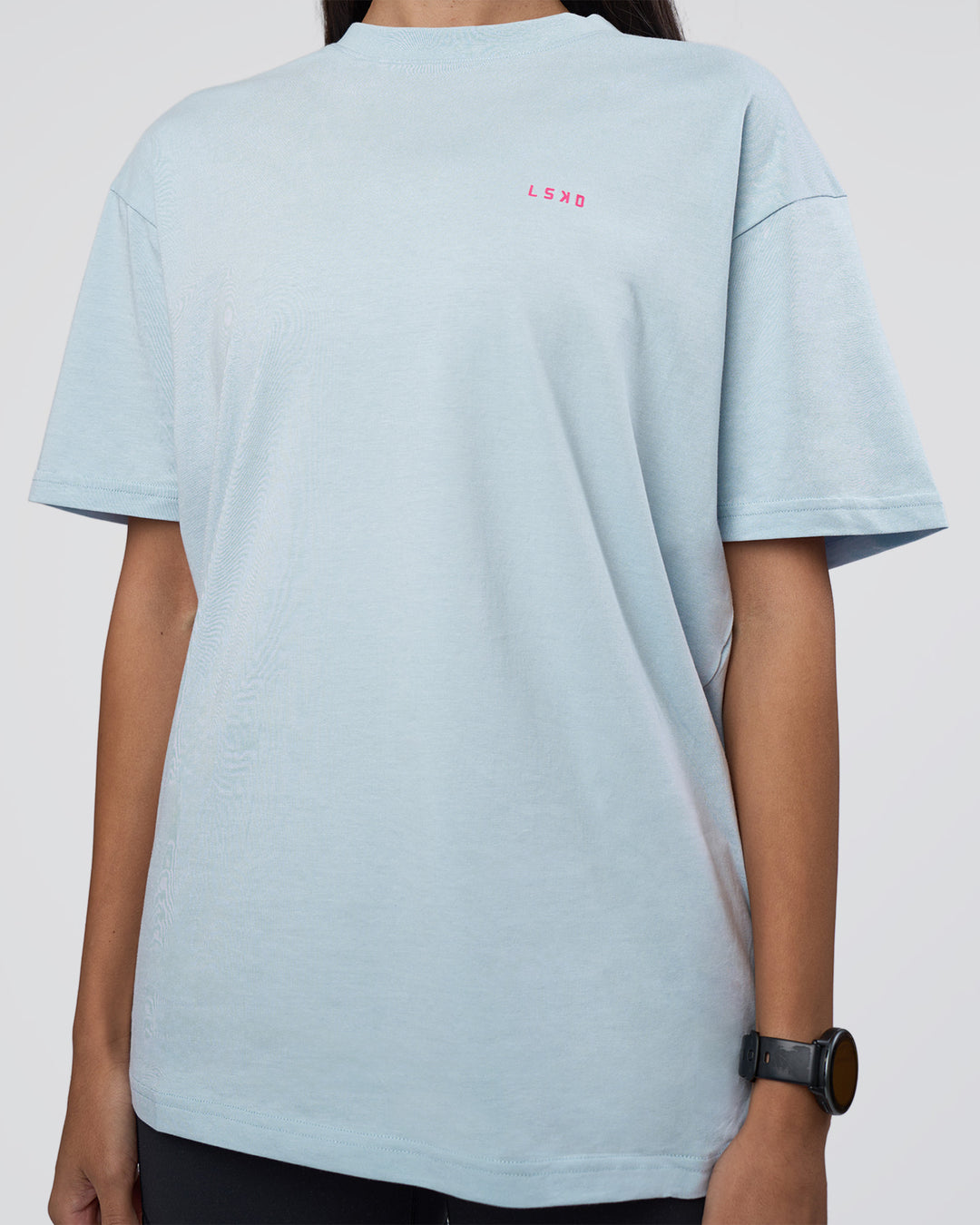 Woman wearing Lifting FLXCotton Oversized Tee - Blue Aura-Ultra Pink | Model:Rhiley | Size:XS
