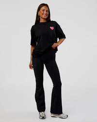 Woman wearing Love the Journey FLXCotton Oversized Tee - Black-Flame | Model:Bianca | Size:XS