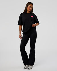 Woman wearing Love the Journey FLXCotton Oversized Tee - Black-Flame | Model:Bianca | Size:XS