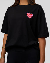 Woman wearing Love the Journey FLXCotton Oversized Tee - Black-Flame | Model:Bianca | Size:XS