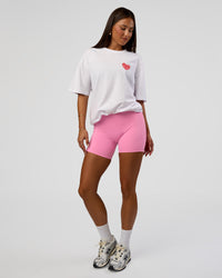 Woman wearing Love the Journey FLXCotton Oversized Tee - White-Candy Pink | Model:Bianca | Size:XS