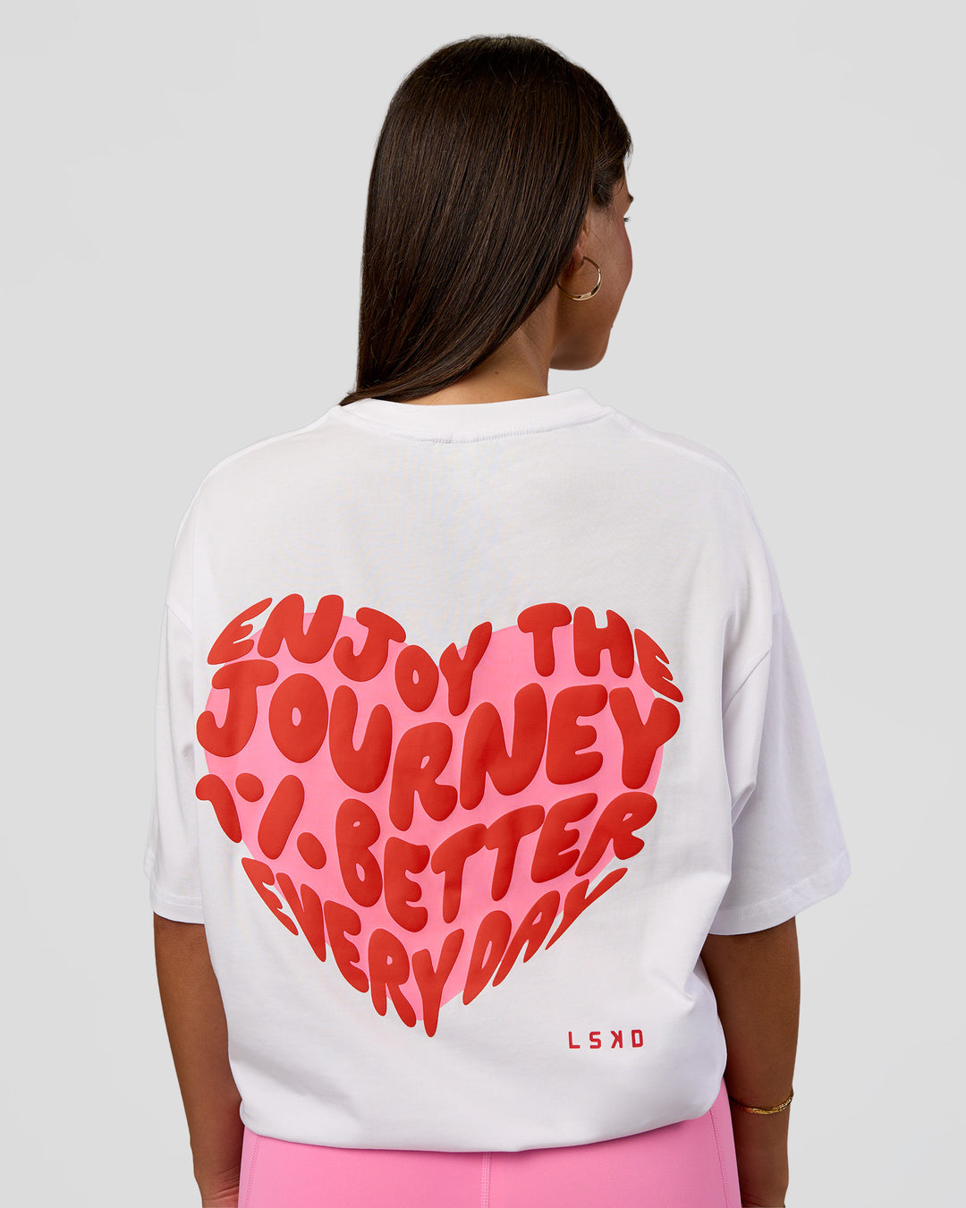 Woman wearing Love the Journey FLXCotton Oversized Tee - White-Candy Pink | Model:Bianca | Size:XS