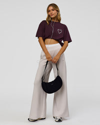 Woman wearing Love The Process FLXCotton Oversize Tee - Midnight Plum-White | Model:Leilani | Size:XS