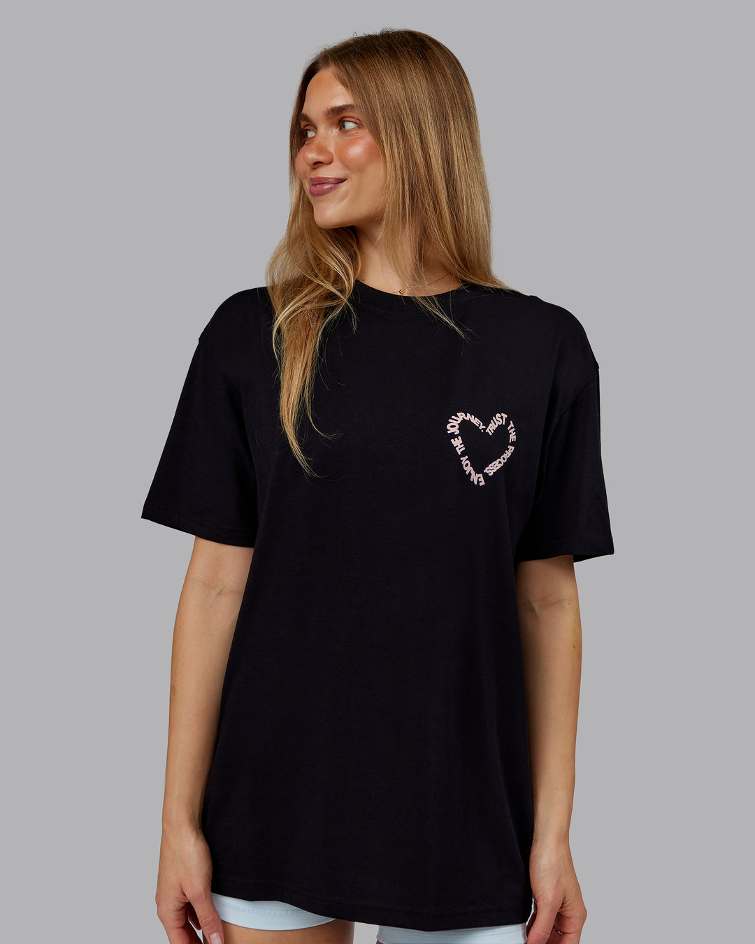 Woman wearing Love The Process FLXCotton Oversize Tee - Black-Peach Fuzz | Model:Emilie | Size:XS