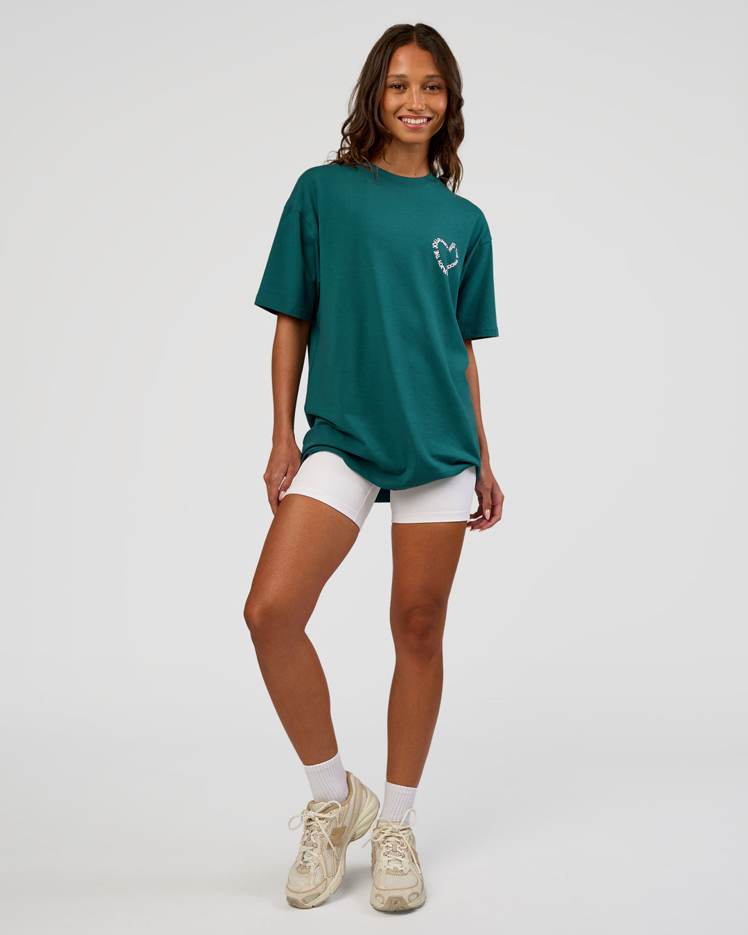 Woman wearing Love The Process FLXCotton Oversize Tee - Transformative Teal-Marshmallow | Model:Dakota | Size:XS