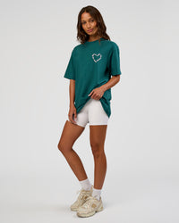 Woman wearing Love The Process FLXCotton Oversize Tee - Transformative Teal-Marshmallow | Model:Dakota | Size:XS