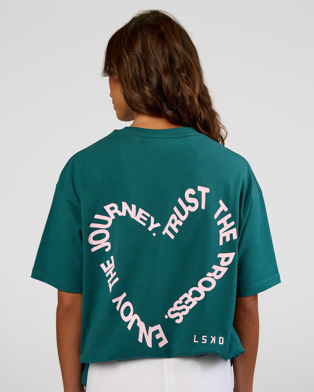 Woman wearing Love The Process FLXCotton Oversize Tee - Transformative Teal-Marshmallow | Model:Dakota | Size:XS