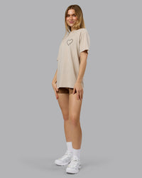 Woman wearing Love The Process FLXCotton Oversize Tee - Shale Beige-Choc | Model:Emilie | Size:XS