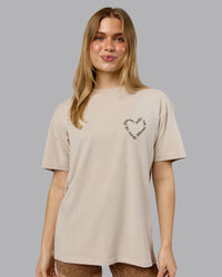 Woman wearing Love The Process FLXCotton Oversize Tee - Shale Beige-Choc | Model:Emilie | Size:XS