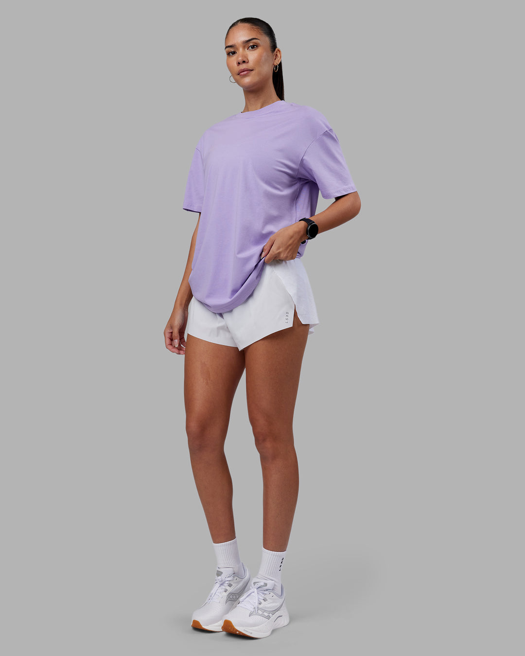 Woman wearing Love The Run FLXCotton Tee Oversize - Violet Ray-Royal Purple | Model:Rhiley | Size:XS