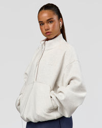 Woman wearing Luxe ZeroCrease Spacer Half Zip - Silver Marl | Model:Sophia | Size:XS