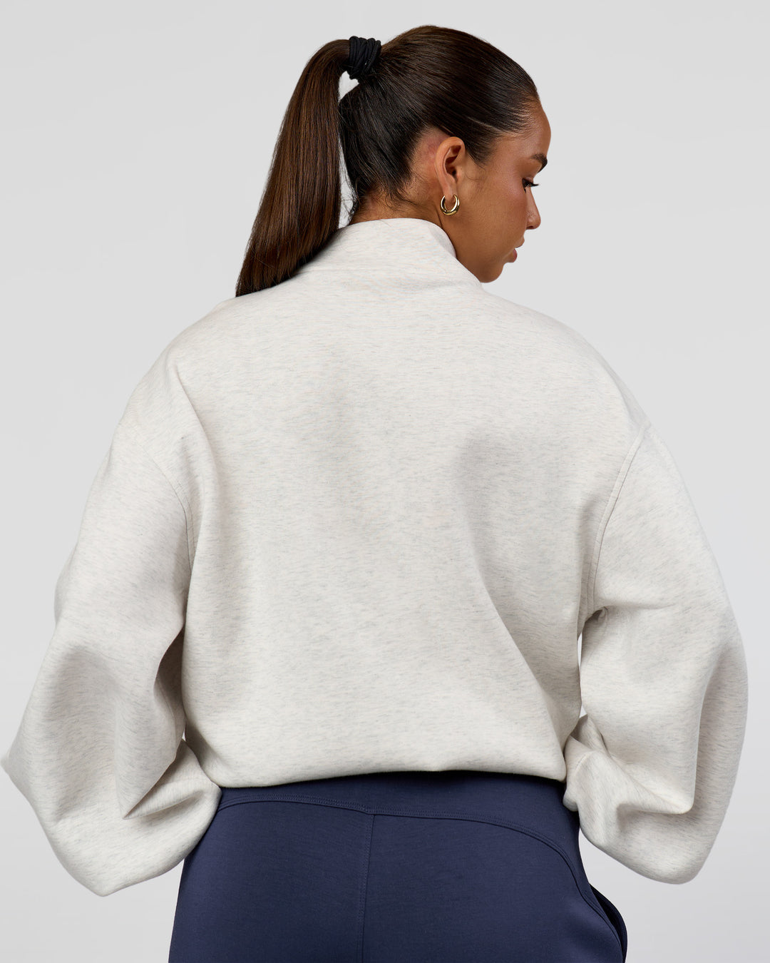 Woman wearing Luxe ZeroCrease Spacer Half Zip - Silver Marl | Model:Sophia | Size:XS