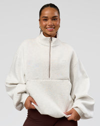 Woman wearing Luxe ZeroCrease Spacer Half Zip - Silver Marl | Model:Sophia | Size:XS