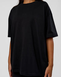 Woman wearing MVP 2.0 Oversized Tee - Black | Model:Kirstyn | Size:XS