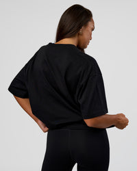 Woman wearing MVP 2.0 Oversized Tee - Black | Model:Kirstyn | Size:XS