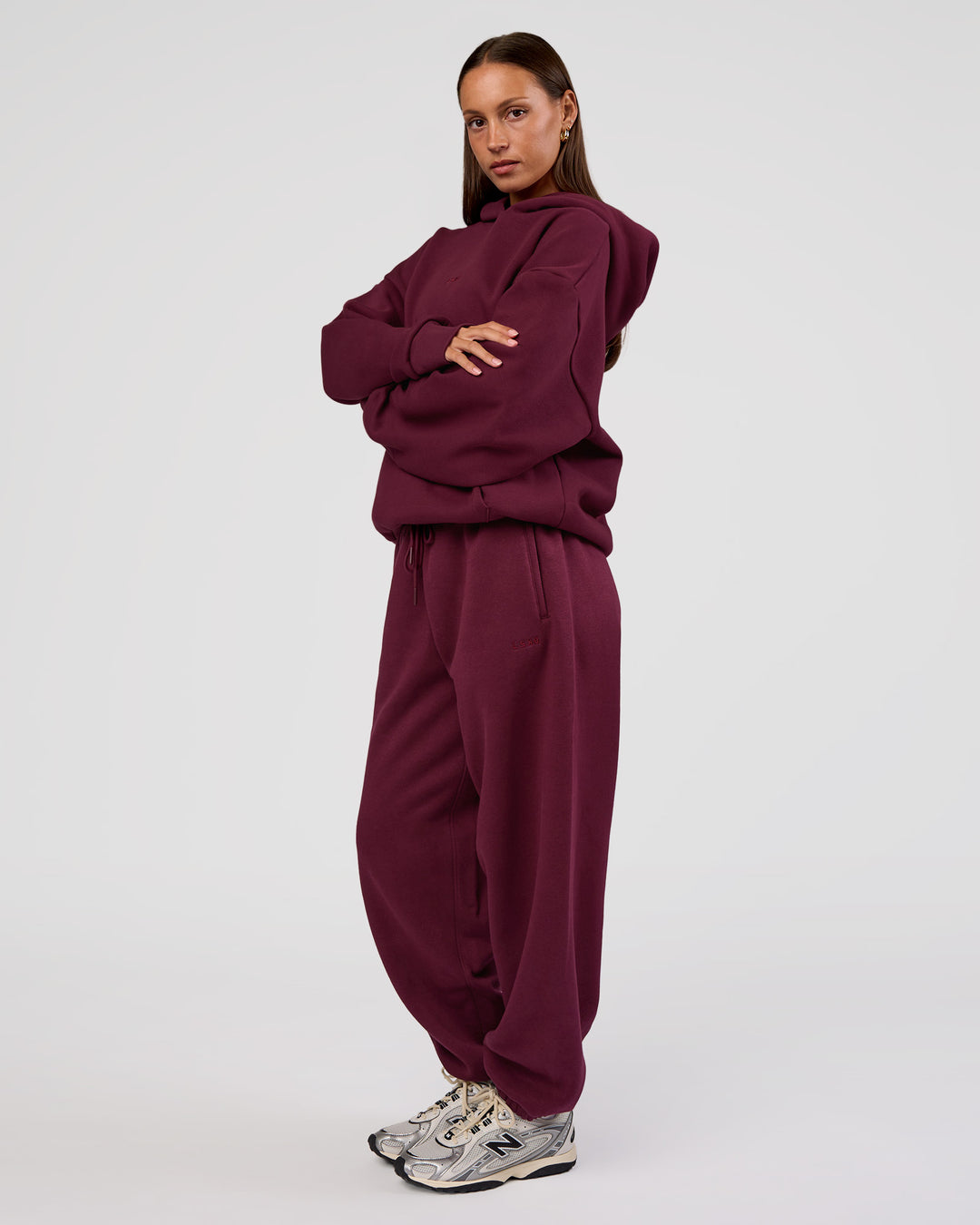 Woman wearing MVP Oversized Hoodie - Cherry Lacquer | Model:Brylee | Size:XS