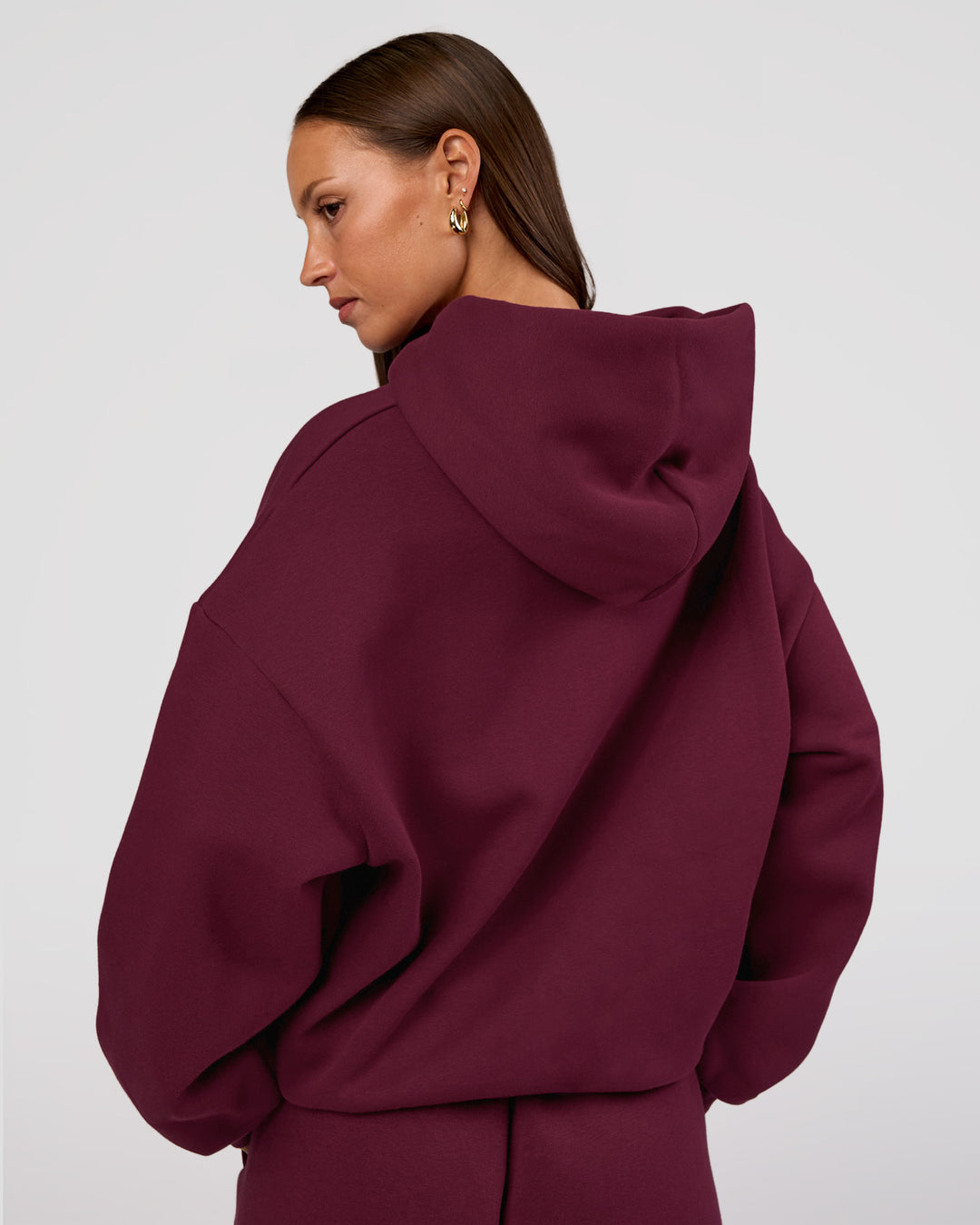 Woman wearing MVP Oversized Hoodie - Cherry Lacquer | Model:Brylee | Size:XS