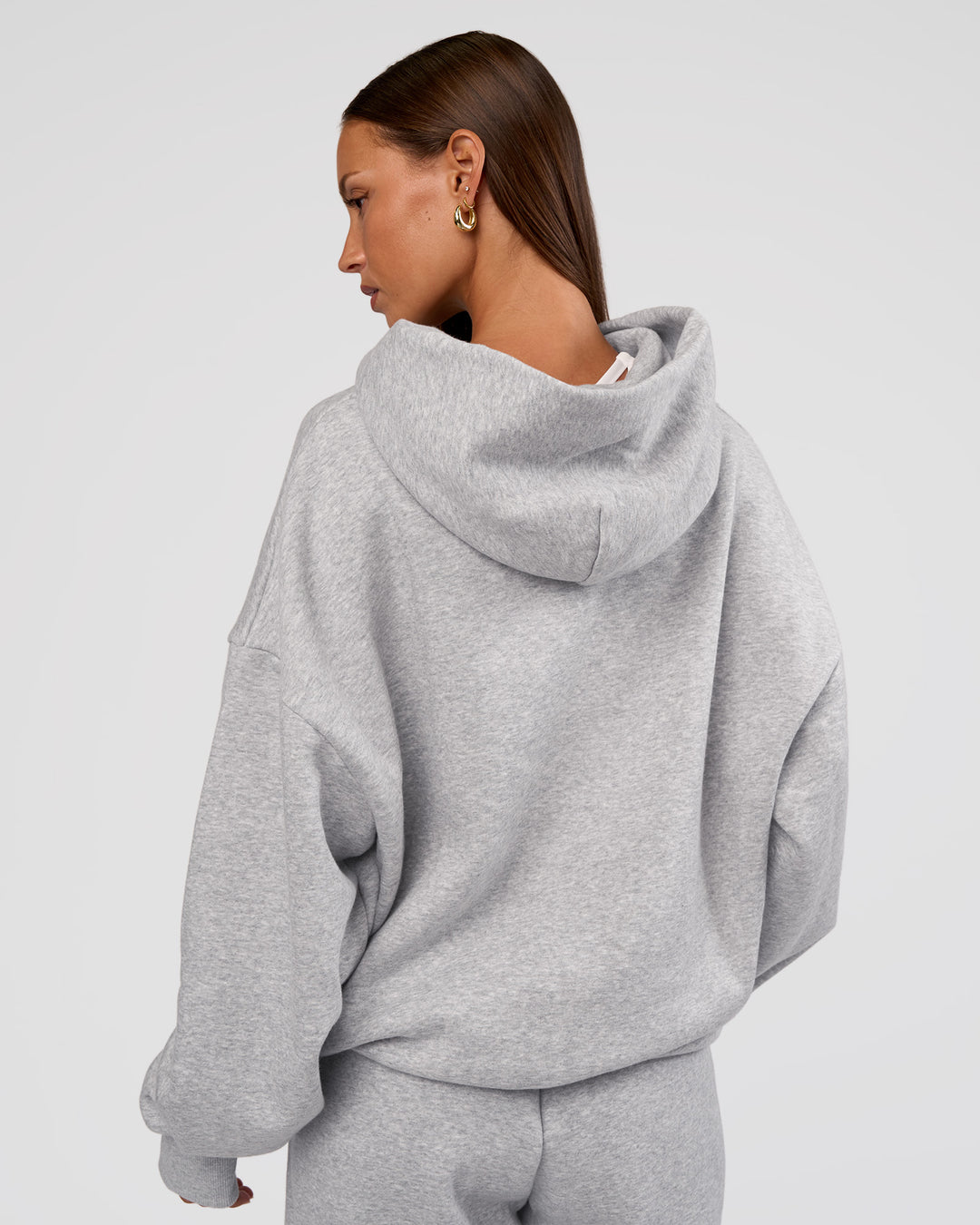 Woman wearing MVP Oversized Hoodie - Light Grey Marl | Model:Brylee | Size:XS