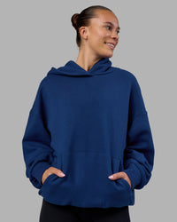Woman wearing MVP Oversized Hoodie - Midnight Blue | Model:Charlize | Size:XS