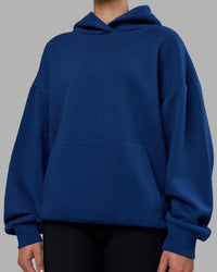 Woman wearing MVP Oversized Hoodie - Midnight Blue | Model:Charlize | Size:XS