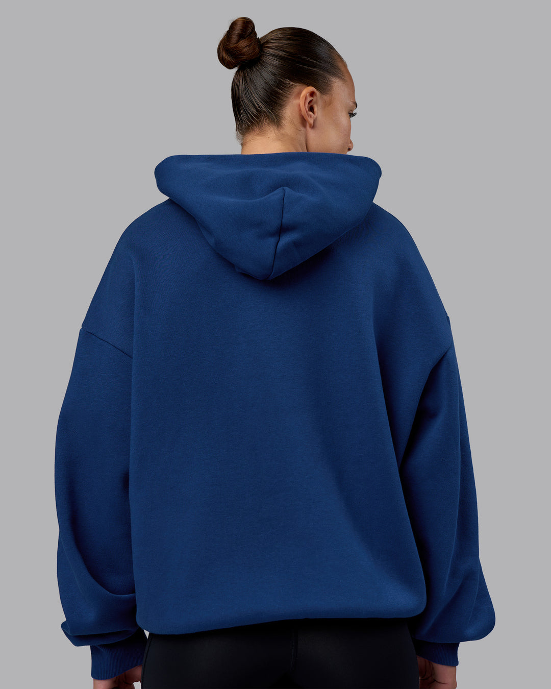 Woman wearing MVP Oversized Hoodie - Midnight Blue | Model:Charlize | Size:XS