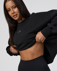 Woman wearing MVP Oversized Sweater - Black-White | Model:Eliza | Size:XS