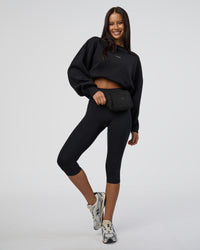 Woman wearing MVP Oversized Sweater - Black-White | Model:Eliza | Size:XS