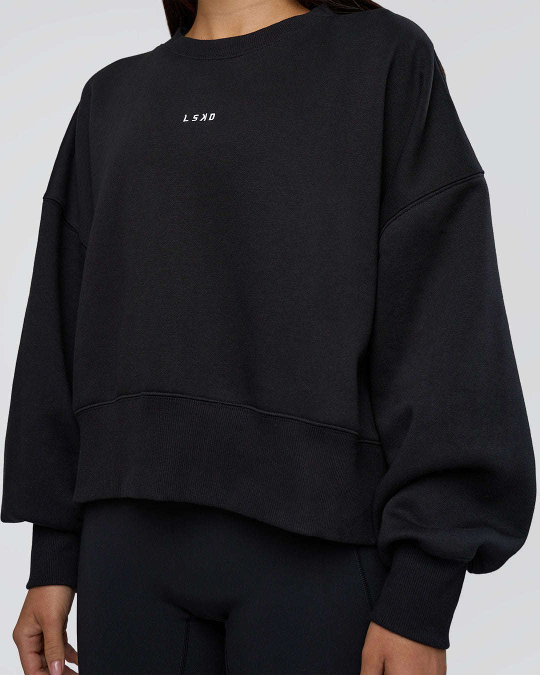 Woman wearing MVP Oversized Sweater - Black-White | Model:Eliza | Size:XS