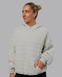 Woman wearing MVP Quilted Oversized Hoodie - Digital Mist-Geometric | Model:Lyss | Size:XS