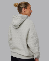 Woman wearing MVP Quilted Oversized Hoodie - Digital Mist-Geometric | Model:Lyss | Size:XS