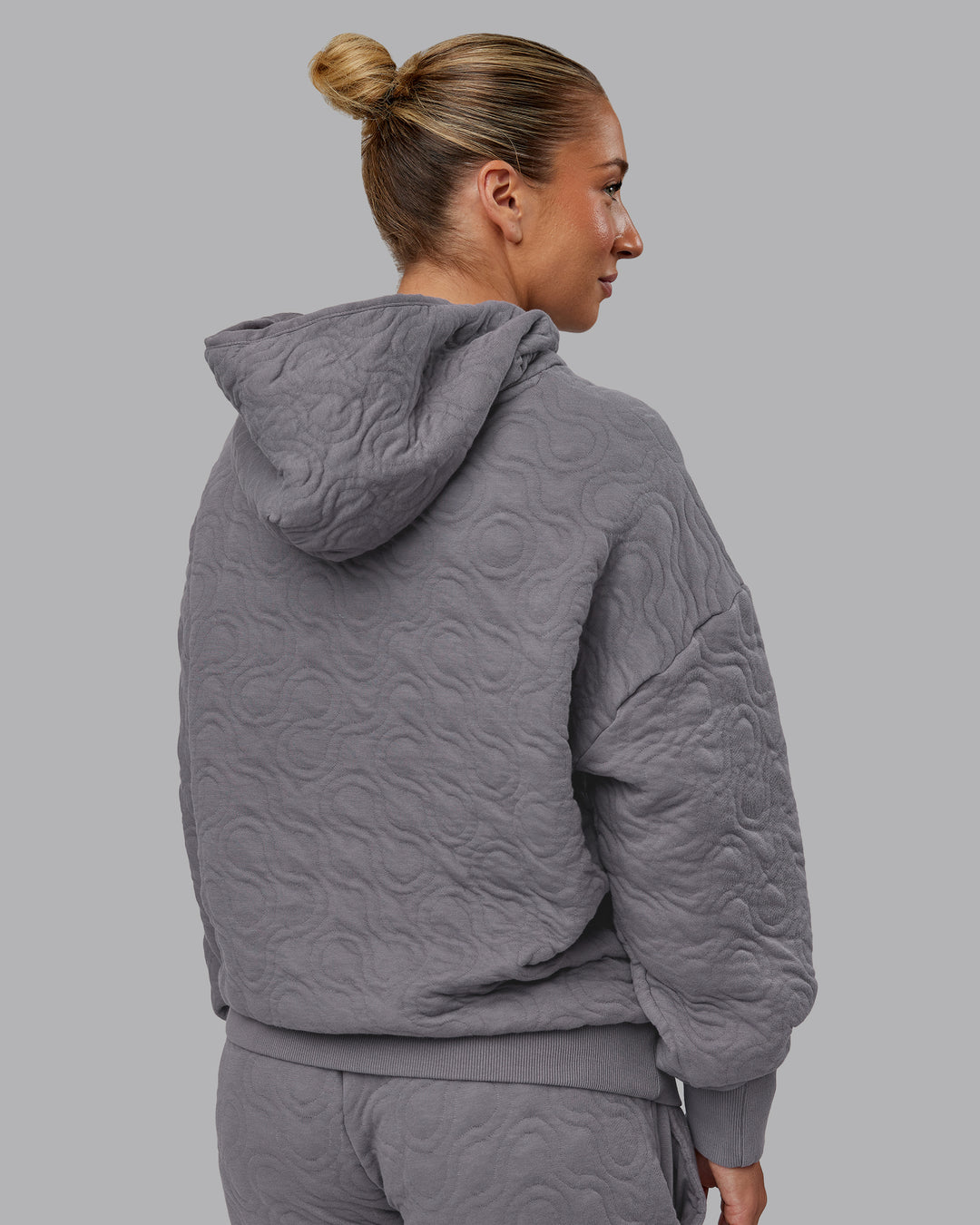 Woman wearing MVP Quilted Oversized Hoodie - Storm Front-Geometric | Model:Lyss | Size:XS