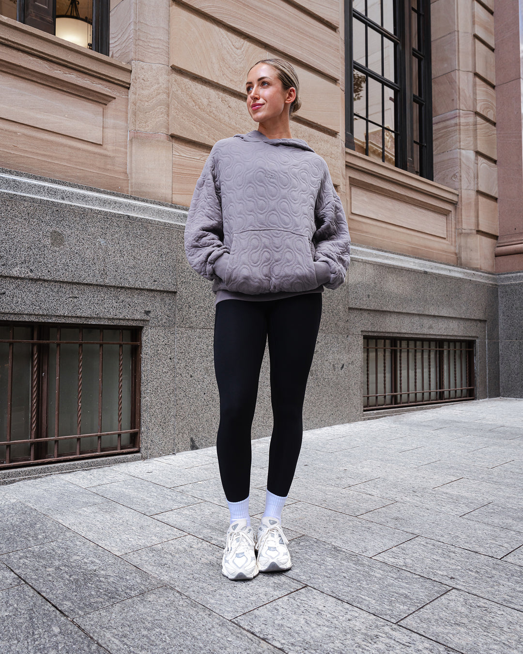 Woman wearing MVP Quilted Oversized Hoodie - Storm Front-Geometric | Model:Paris | Size:XS