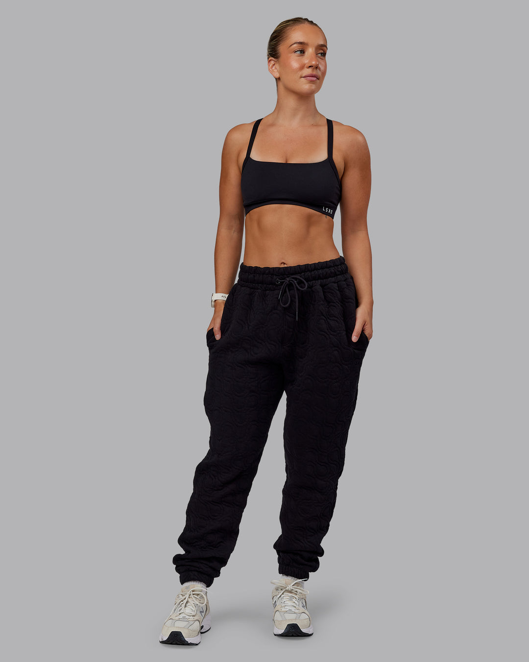 Woman wearing MVP Quilted Track Pant - Black-Geometric | Model:Lyss | SIze:XS