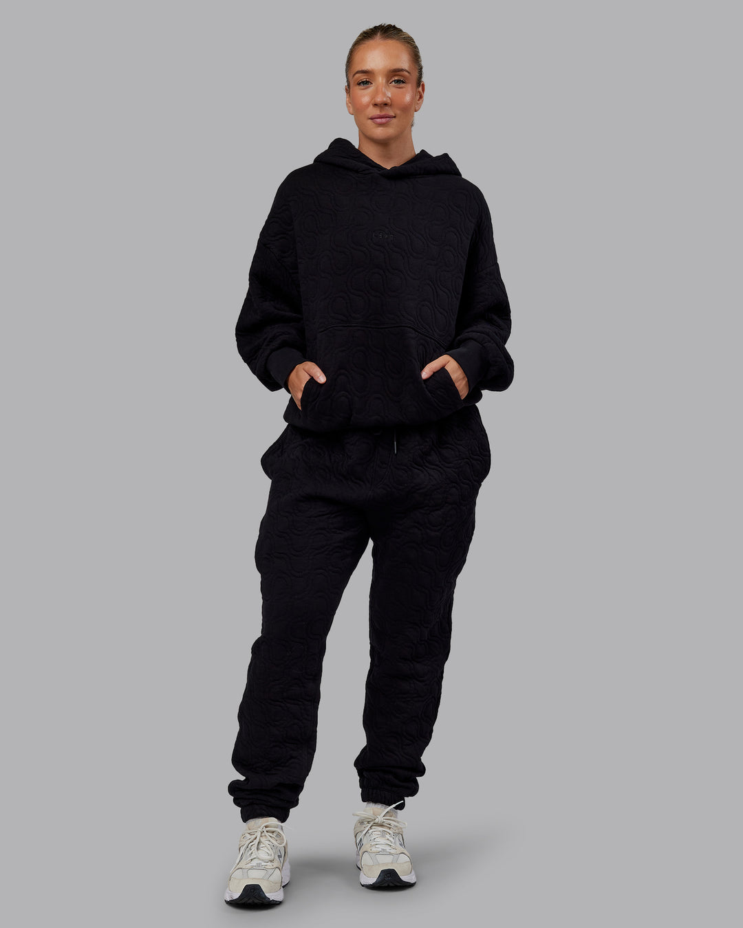 Woman wearing MVP Quilted Track Pant - Black-Geometric | Model:Lyss | SIze:XS