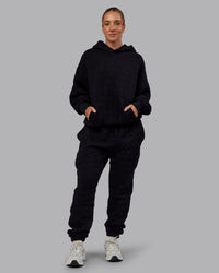 Woman wearing MVP Quilted Track Pant - Black-Geometric | Model:Lyss | SIze:XS