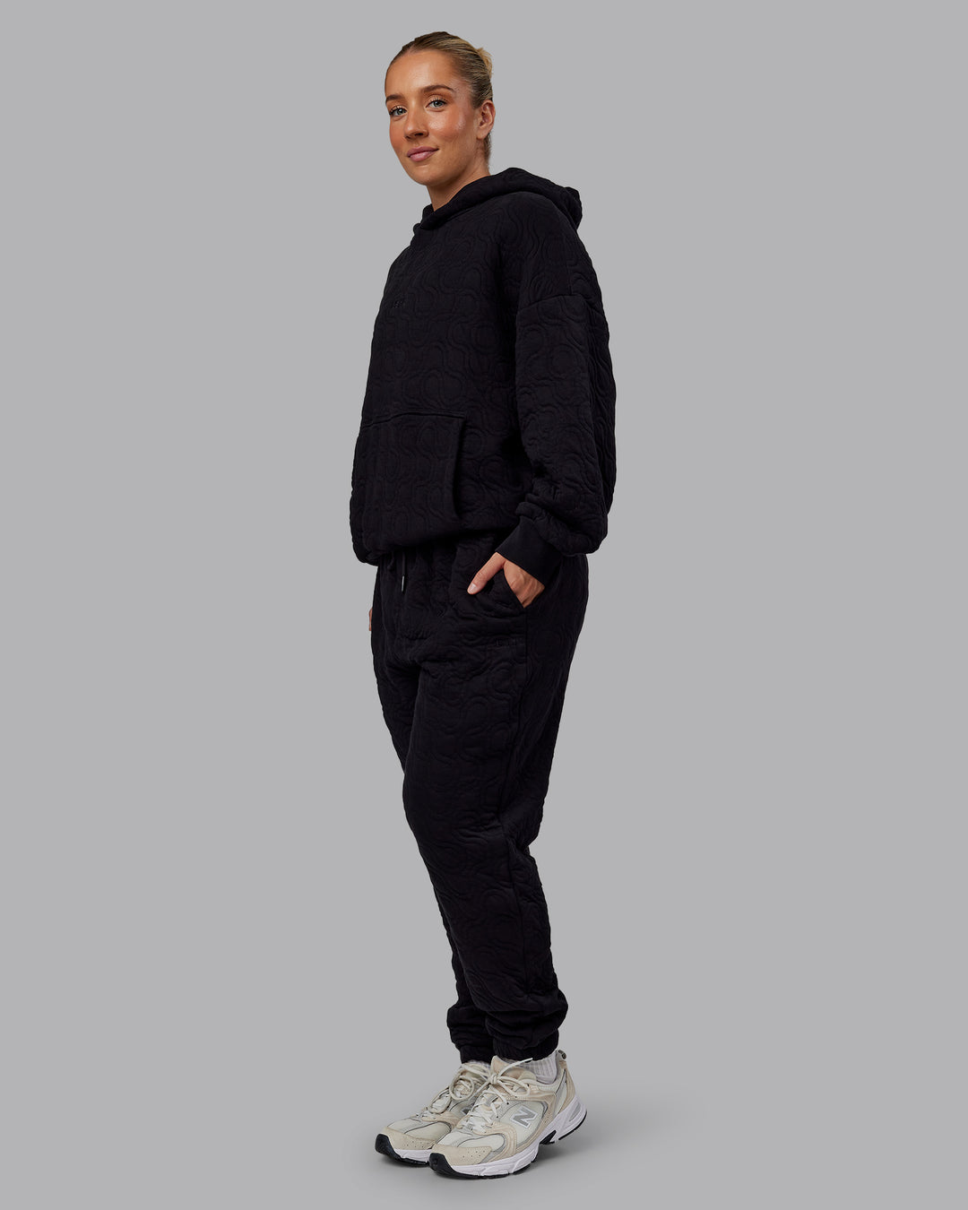 Woman wearing MVP Quilted Track Pant - Black-Geometric | Model:Lyss | SIze:XS