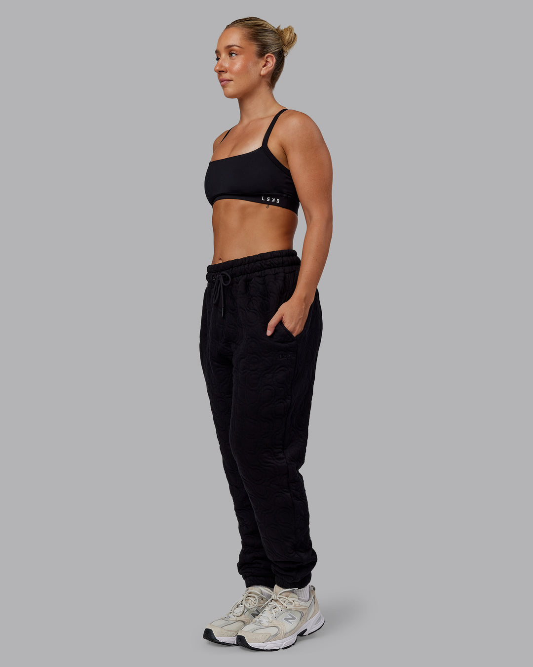 Woman wearing MVP Quilted Track Pant - Black-Geometric | Model:Lyss | SIze:XS