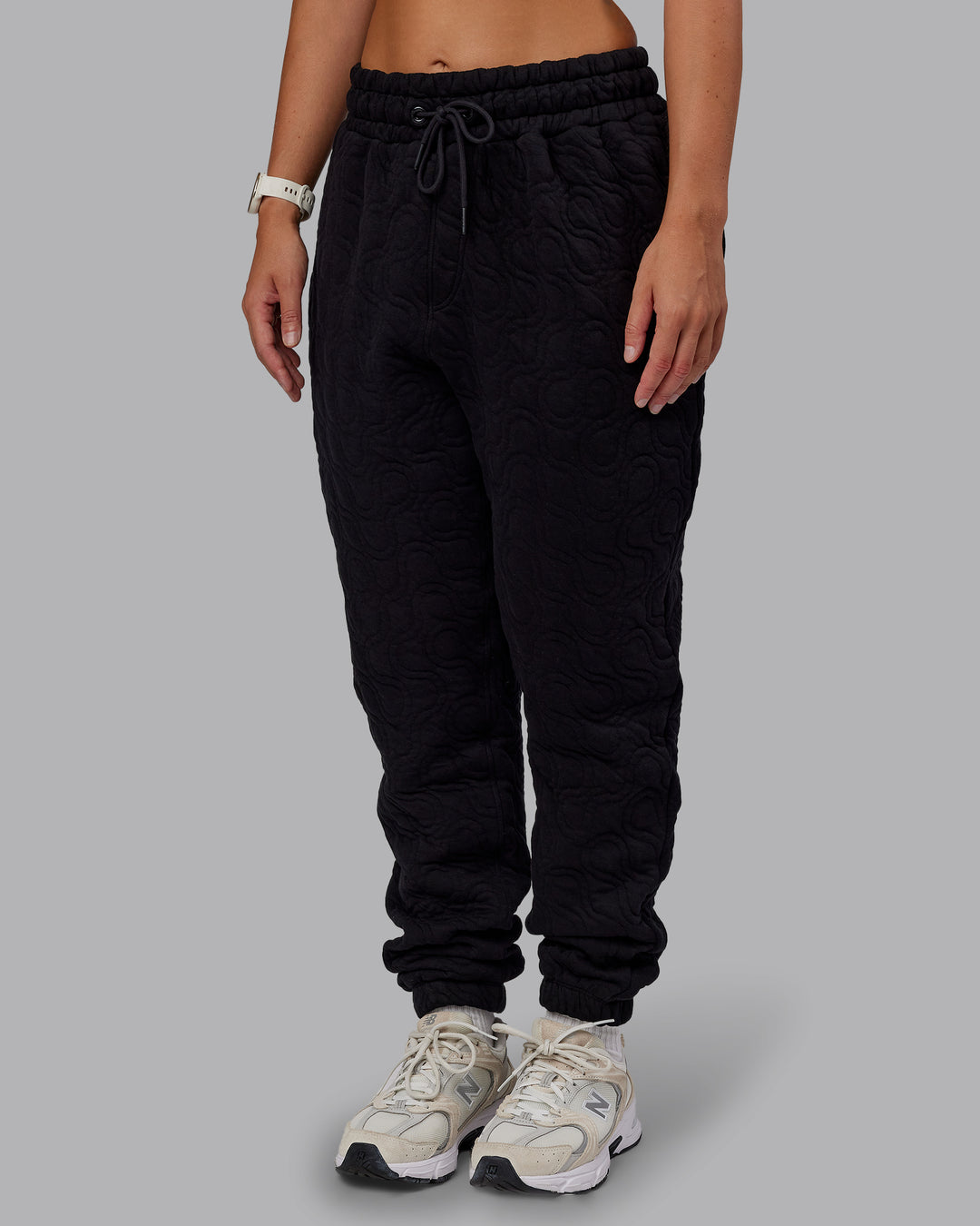 Woman wearing MVP Quilted Track Pant - Black-Geometric | Model:Lyss | SIze:XS