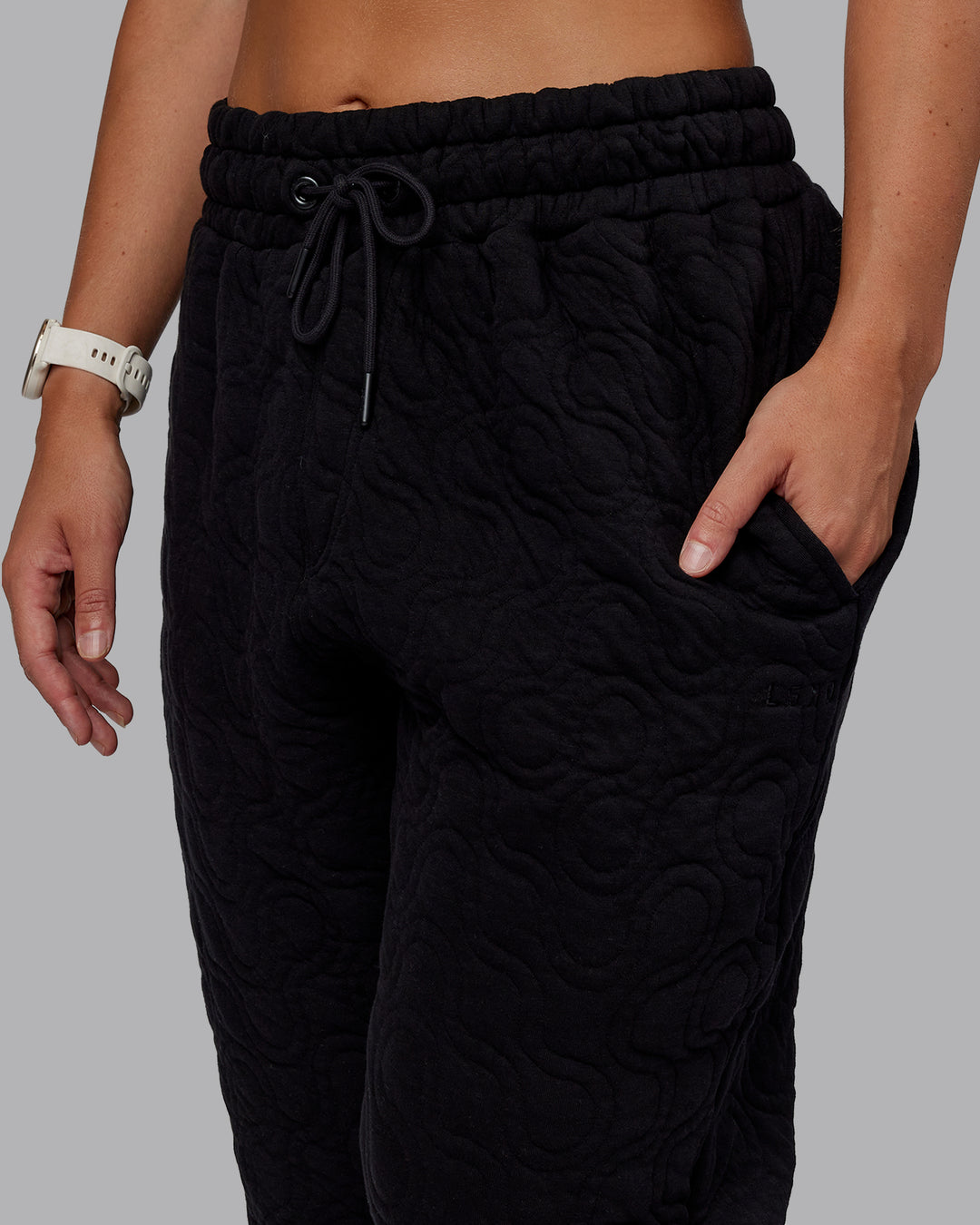 Woman wearing MVP Quilted Track Pant - Black-Geometric | Model:Lyss | SIze:XS
